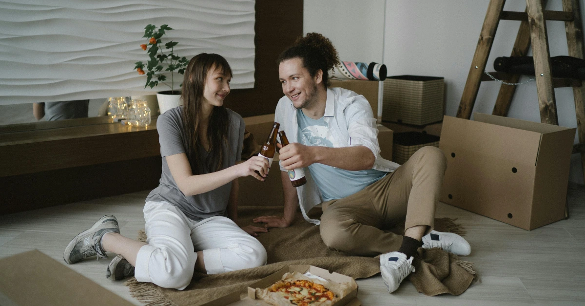 A Couple Celebrating After Moving In a New Home