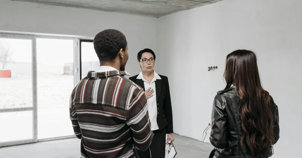 A Real Estate Agent Touring the Clients on the House A Real Estate Agent Touring the Clients on the House