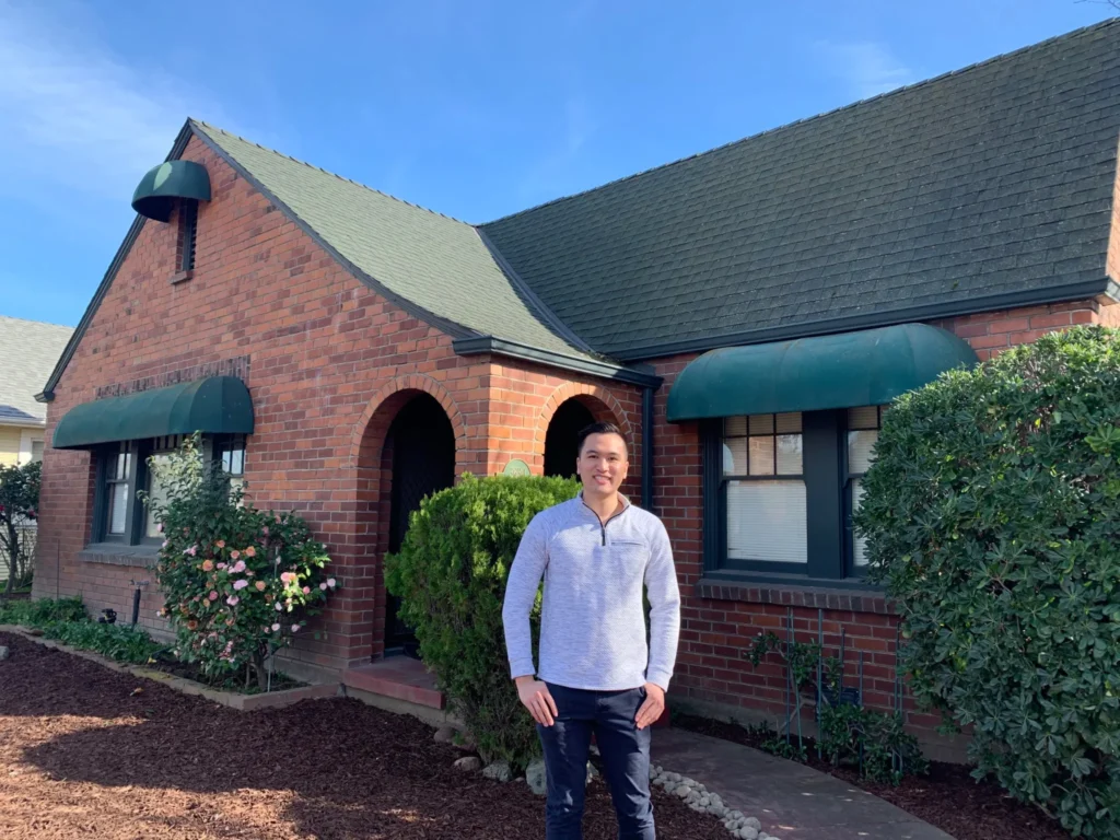 Ryan chaw in front of rental property investment