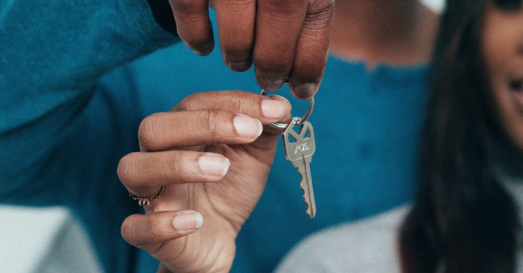 Image of couple holding keys to a house