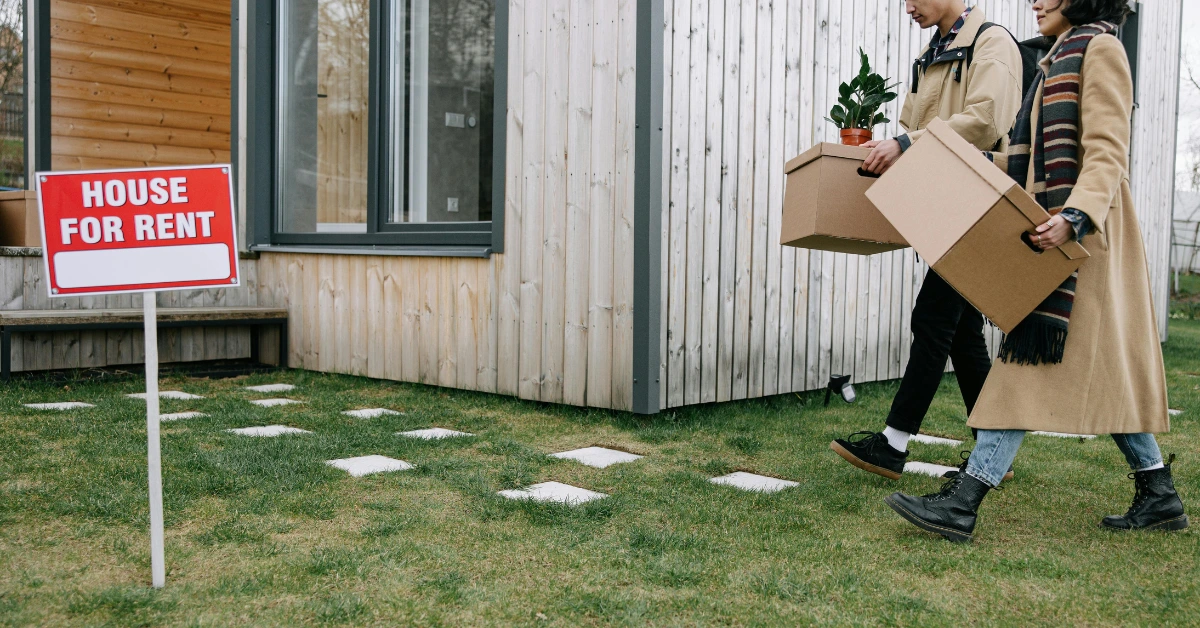 Couple Holding Brown Boxes