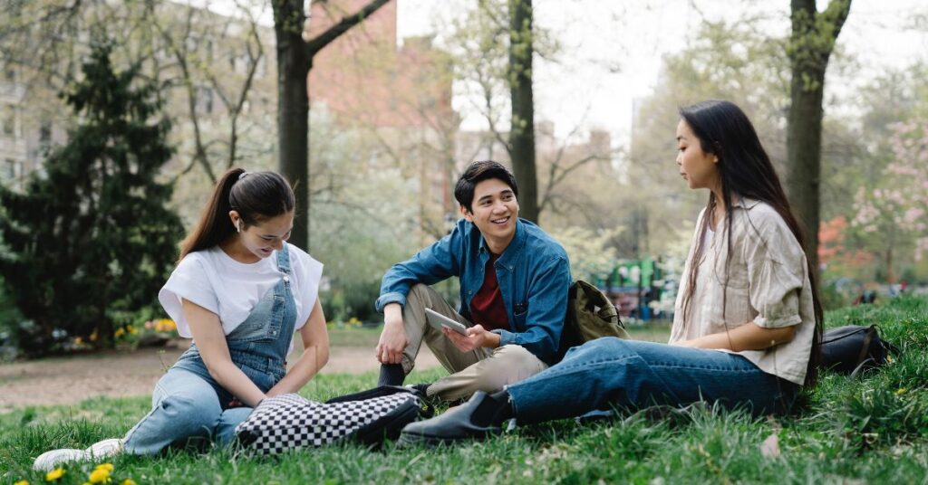 Image of students chatting outside