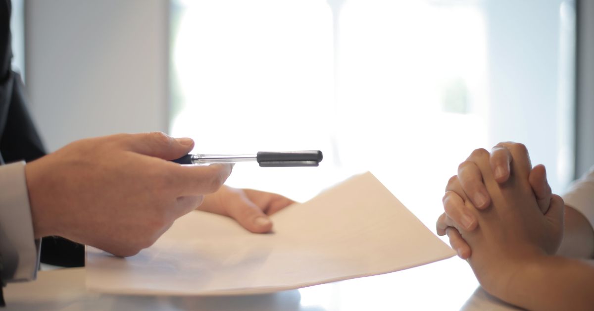 image of people signing rental lease